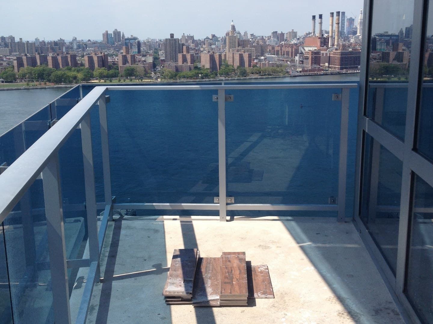 Empty concrete high-rise balcony before flooring install