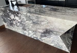 Close-up of book-matched marble waterfall countertop