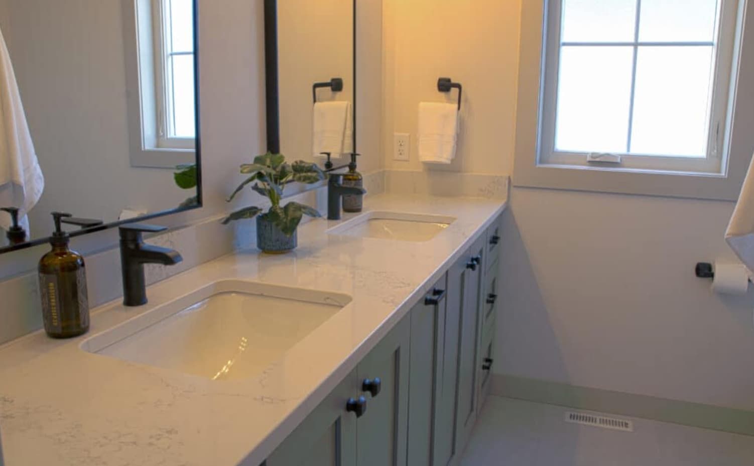 Bathroom vanity with marble-look quartz countertop and double undermount sinks