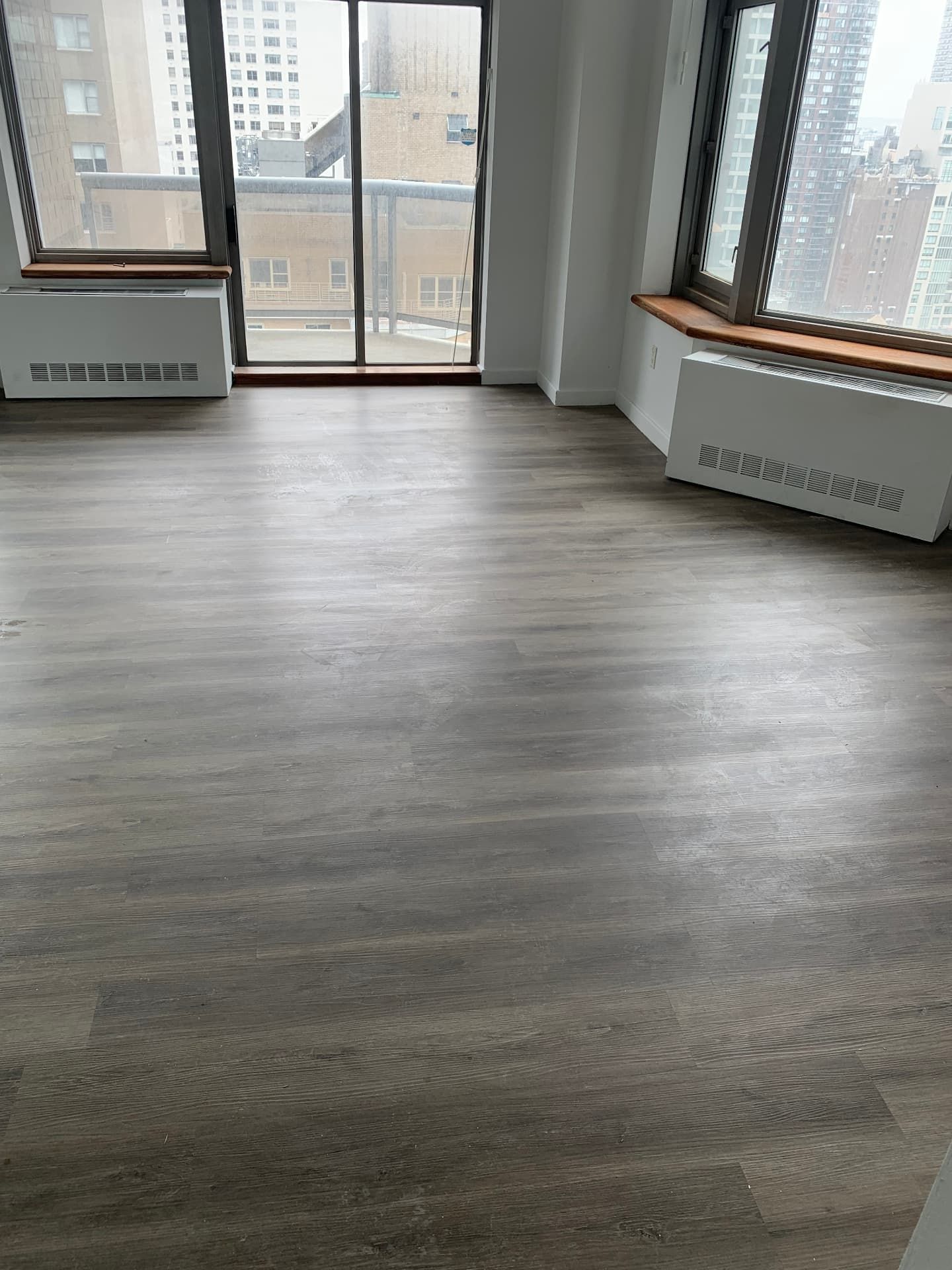 Cool gray plank flooring in a Manhattan high-rise apartment