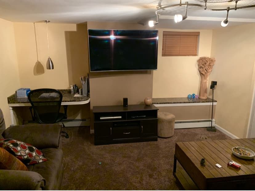 Basement living area before paint and refresh